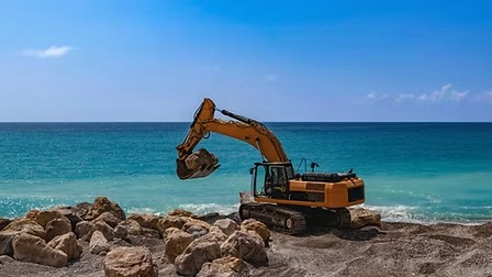 Excavator working on a beach site